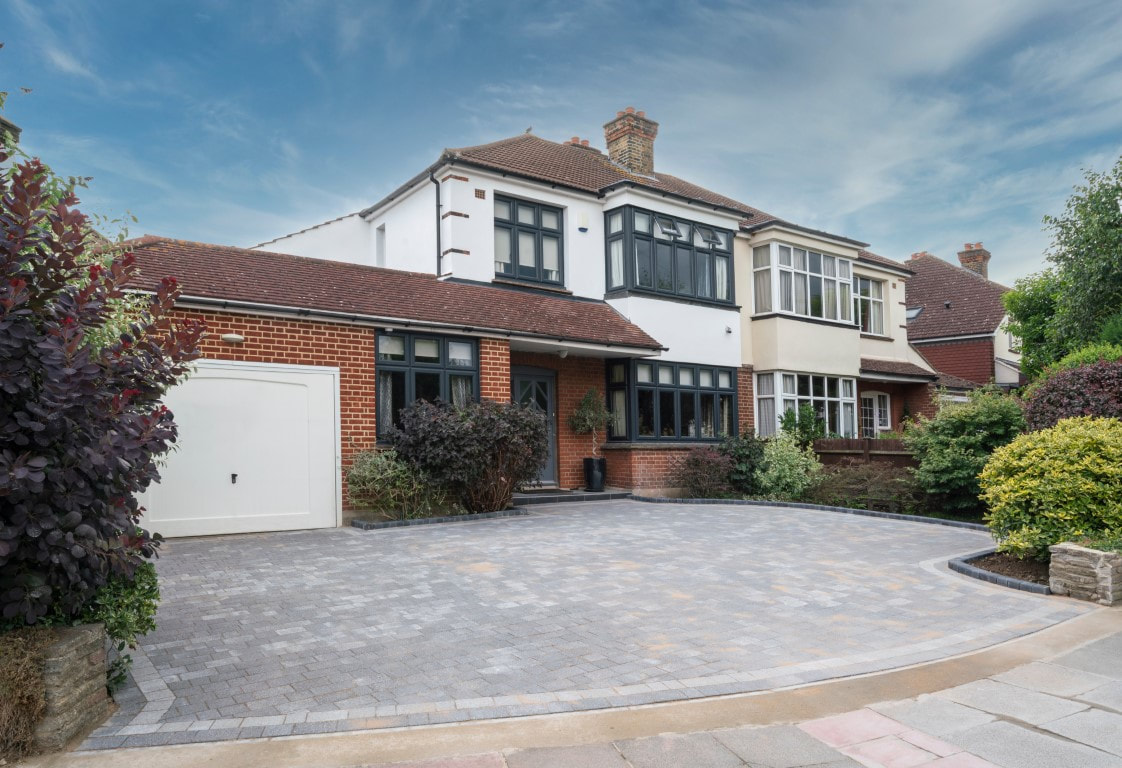 An image of a stunning patio brick paving in front of a house