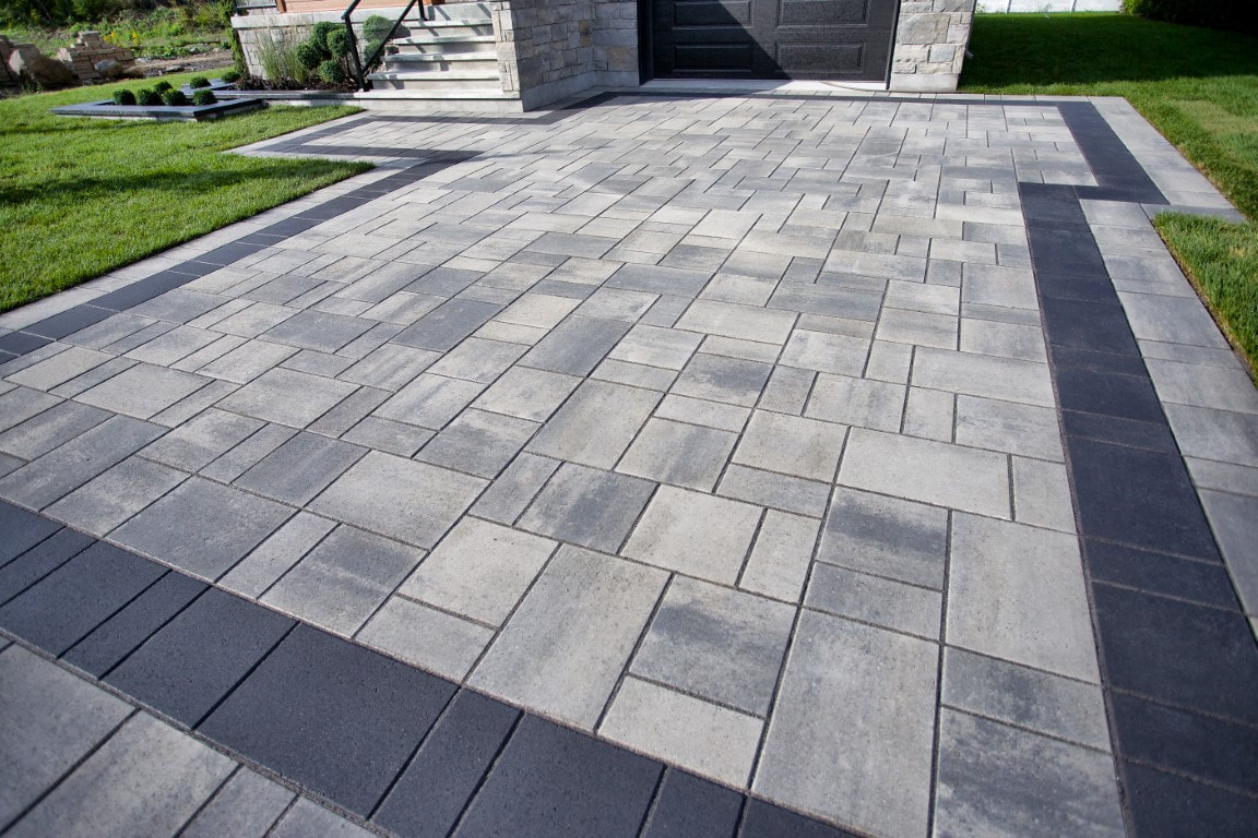 A picture of a beautiful driveway paving in front of a house